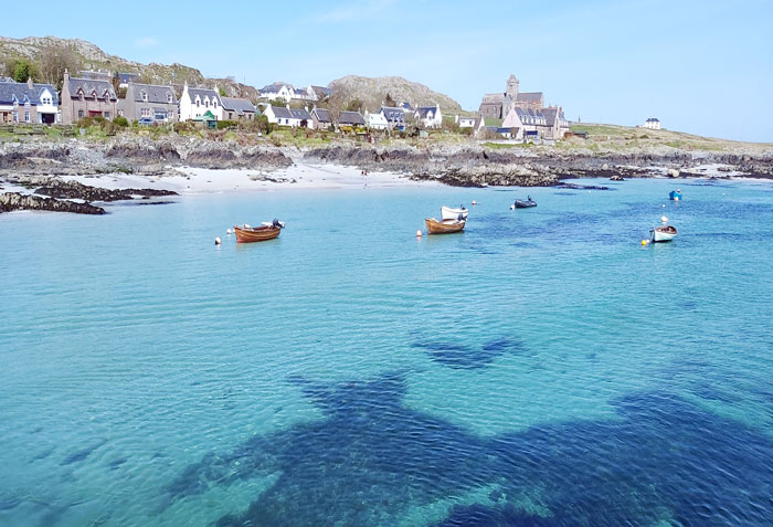 view-of-iona-abbey-and-aqua-blue-sea-from-boat